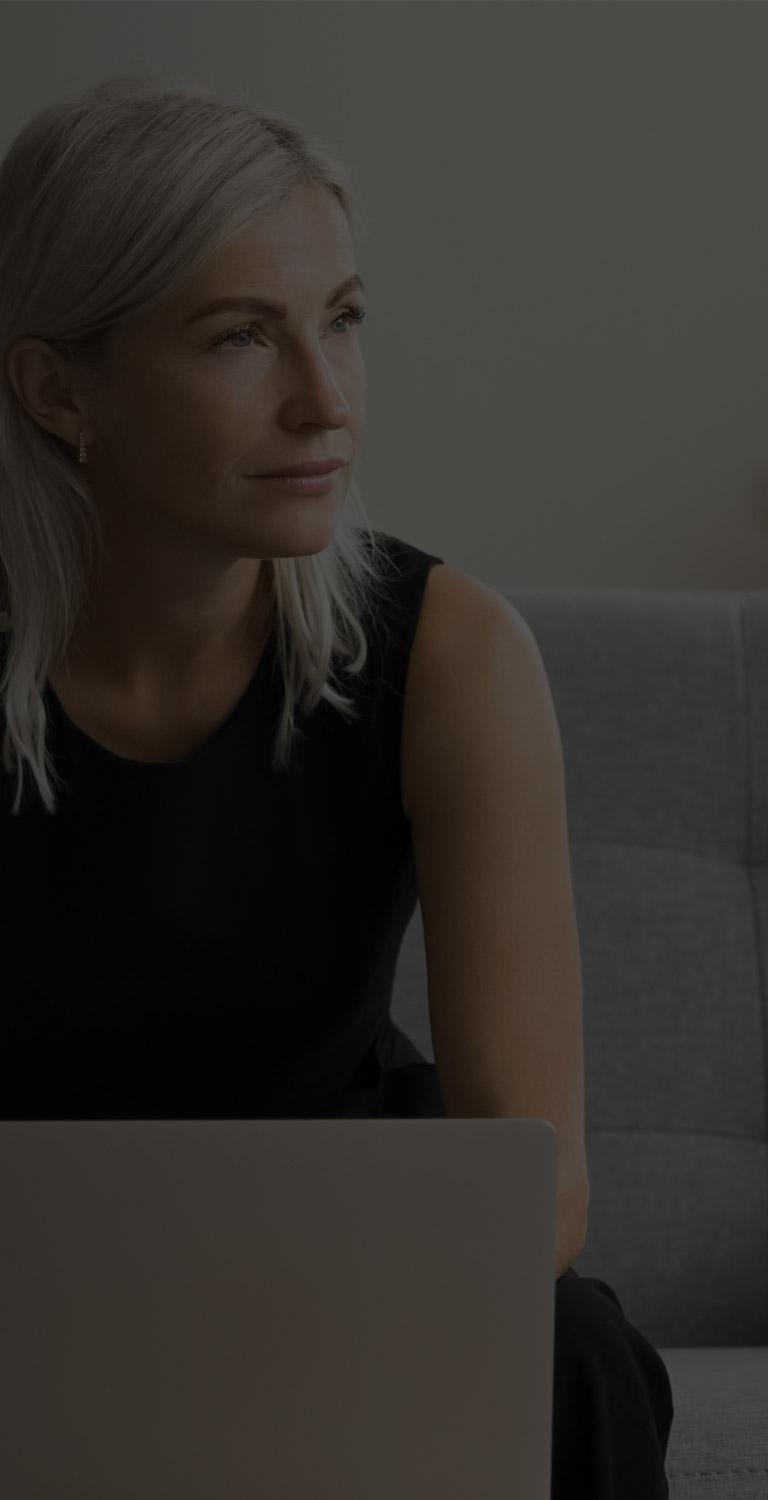 Middle aged woman looking content mobile