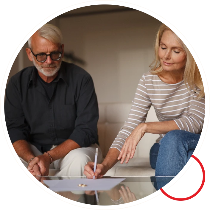 Older couple signing separation agreement