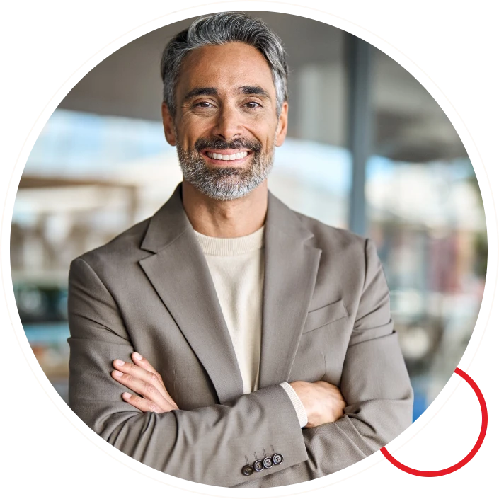 Smiling professional middle aged man with arms folded