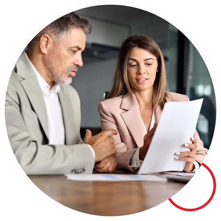 Two business professionals reviewing document
