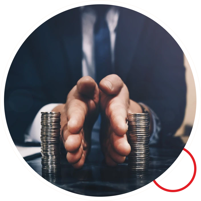 Two hands dividing stacks of coins