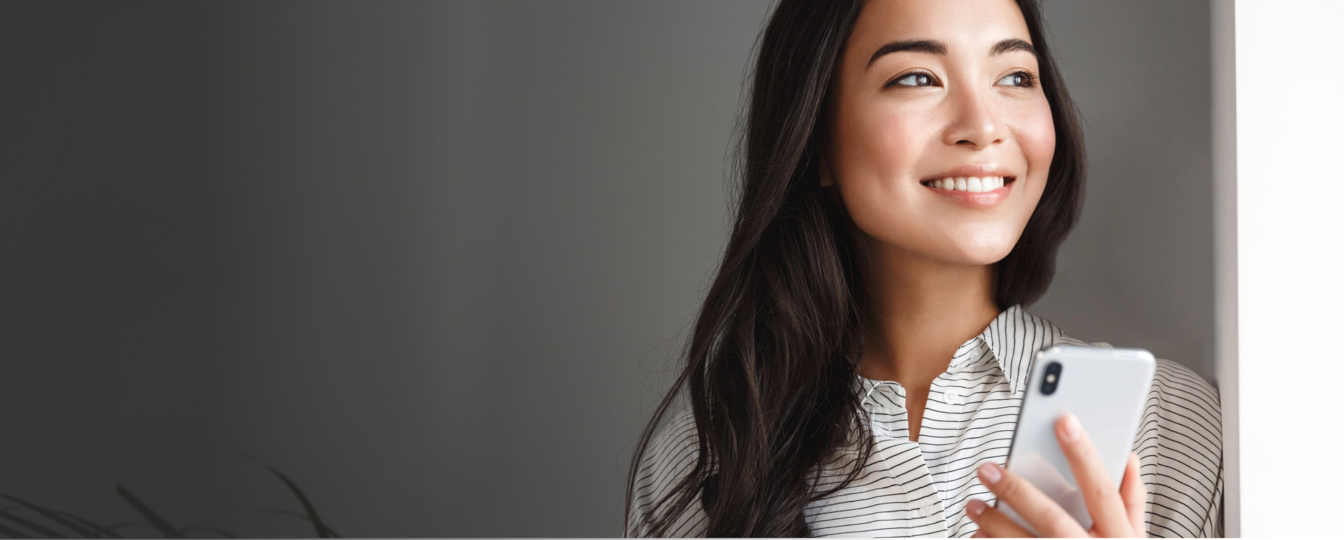 Woman looking hopeful looking outside window