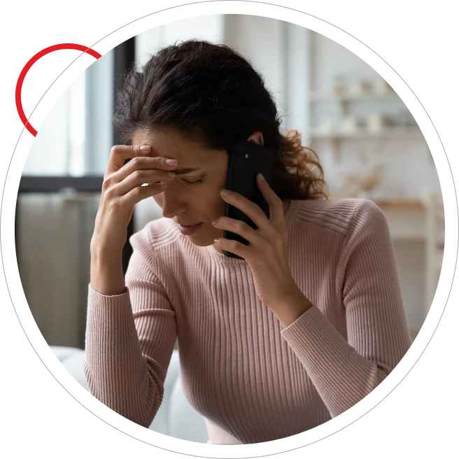 Woman on phone looking frustrated